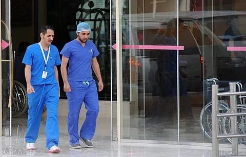 Saudi medical staff leave the emergency department at a hospital in Riyadh.