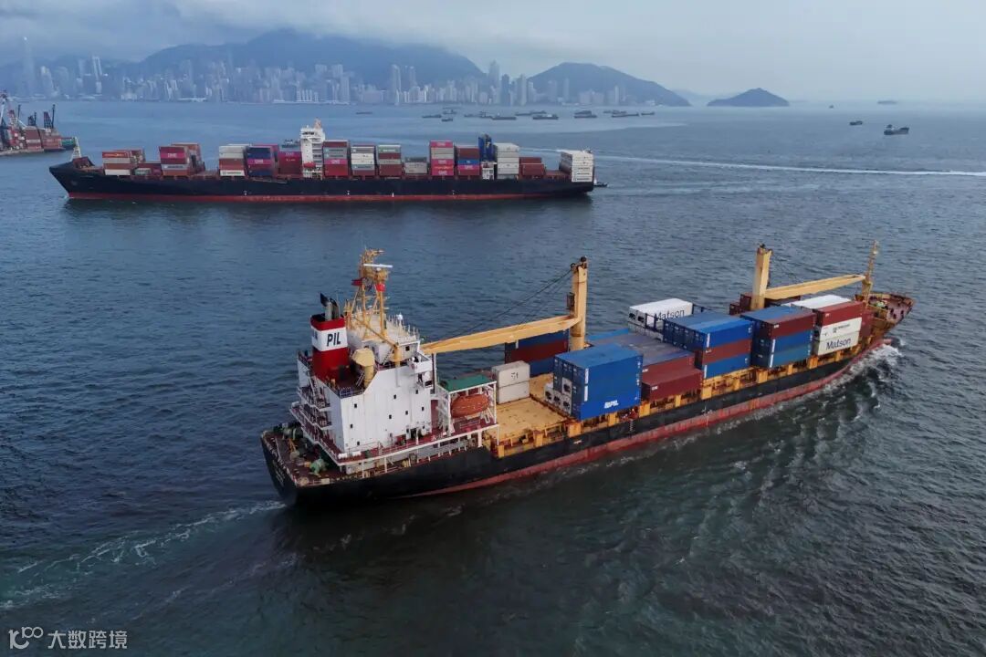 Vessels carrying shipping containers sail near Kwai Tsing Container Terminal in Hong Kong