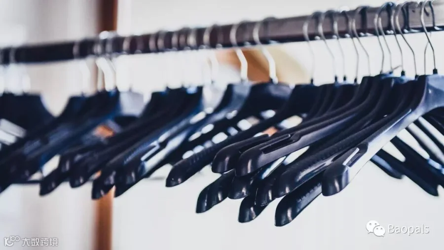 Empty Wardrobe Stand With Black Hangers At Business Event Venue.