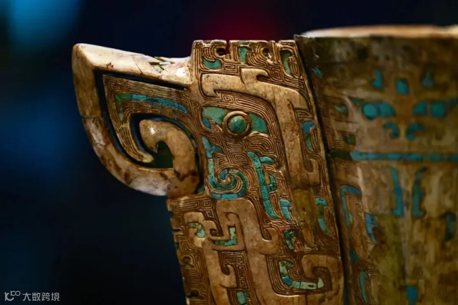 Details of the ivory cup discovered in the tomb of Lady Fu Hao and its “taotie” pattern made from inlaid turquoise chips. Wu Bo/VCG