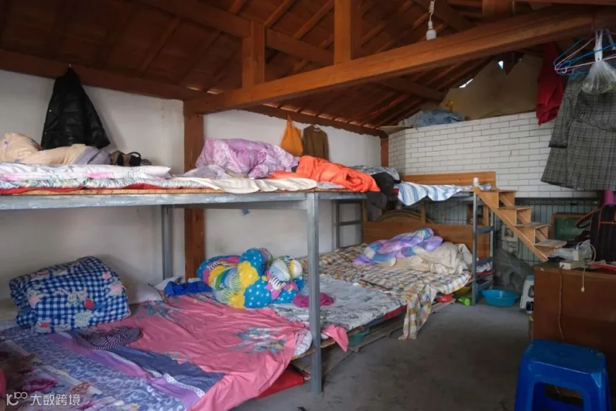 A dormitory for tea pickers, where migrant workers sleep shoulder to shoulder.