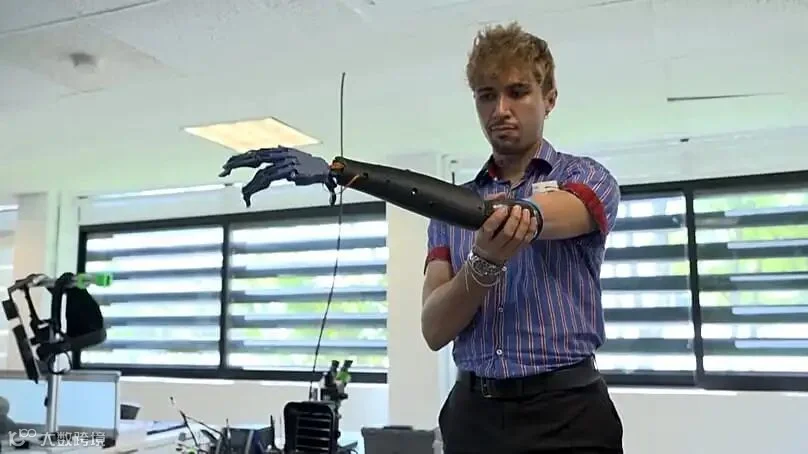 Alberto Orozco, meromelia patient and E-Redi first user, wearing and testing robotic arm