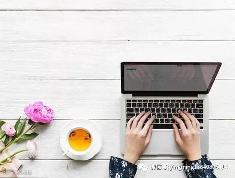 Macbook Pro Beside White Cup And Saucer On Table