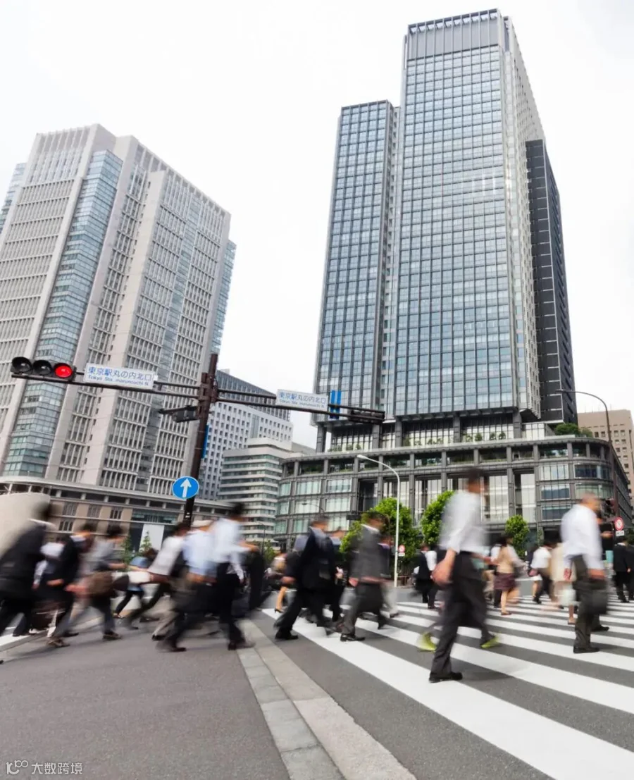 Crowds of Commuters at Crosswalk in Tokyo